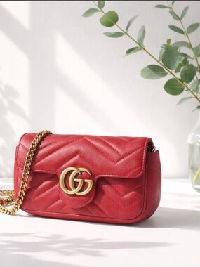 Gucci Red Leather Mini Marmot Crossbody Bag.